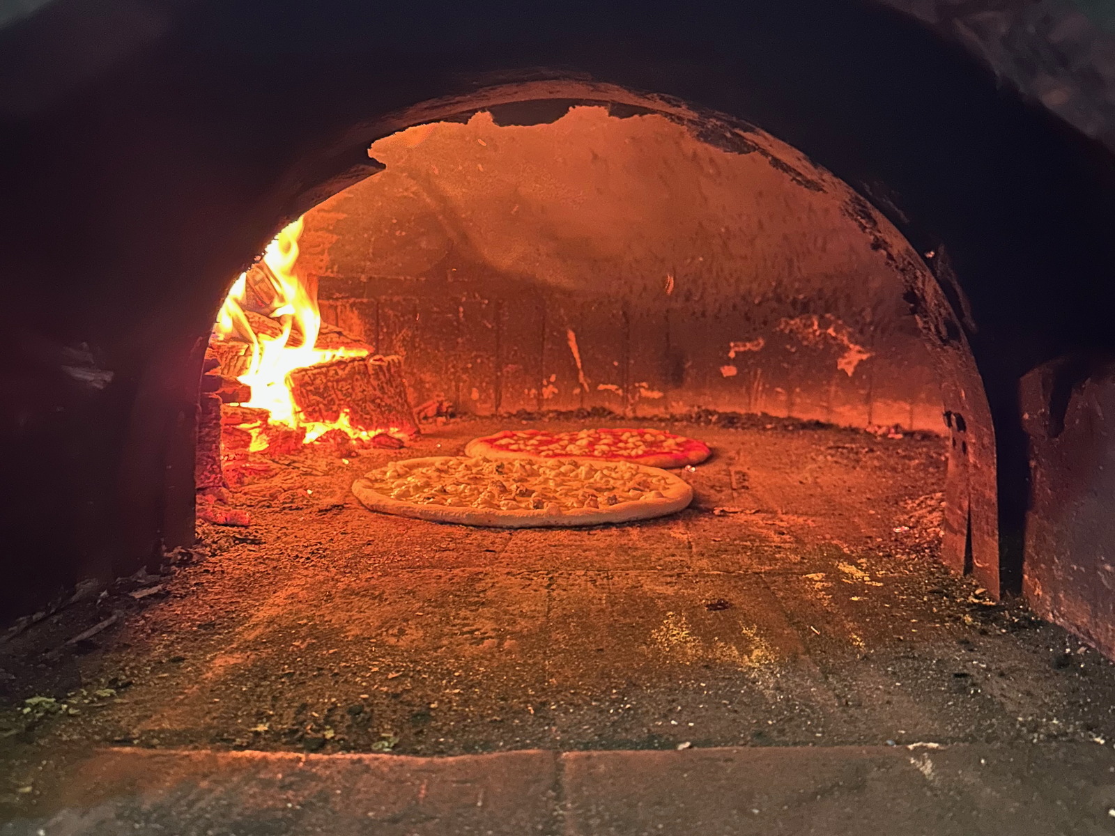 Pizza in the oven at Restoran Angelo